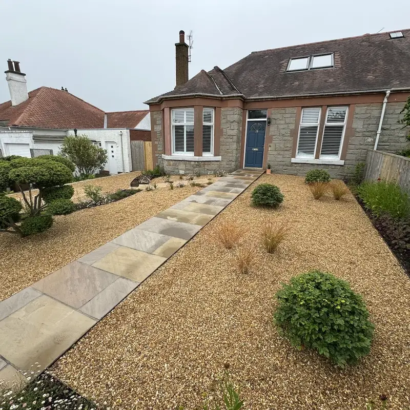 Stonemason laying a Caithness stone path